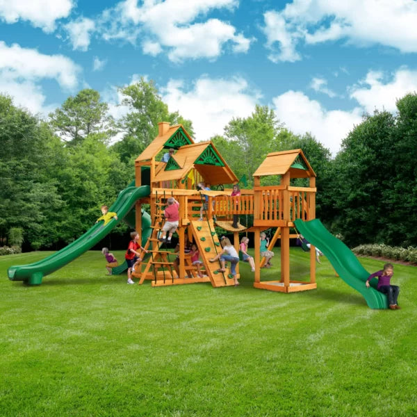 Gorilla Playsets Treasure Trove II Wooden Swing Set with 3 Slides, Clatter Bridge and Tower, and Rock Climbing Wall
